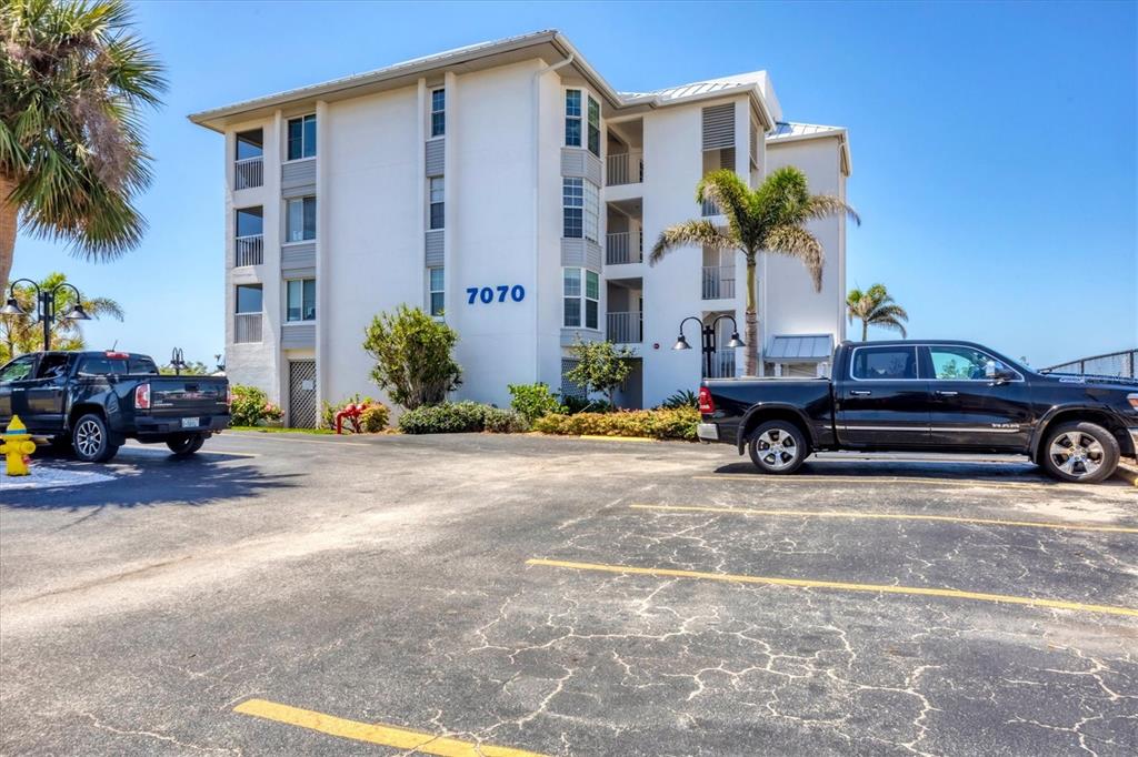 7070 Placida Road, Unit 1230 Placida, FL 33946 - Photo 8 of 60 a car parked in front of a building