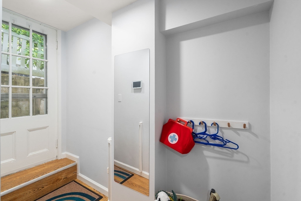 95 Langley Road, Unit 1 Newton, MA 02459 - Photo 17 of 22 a room with a window