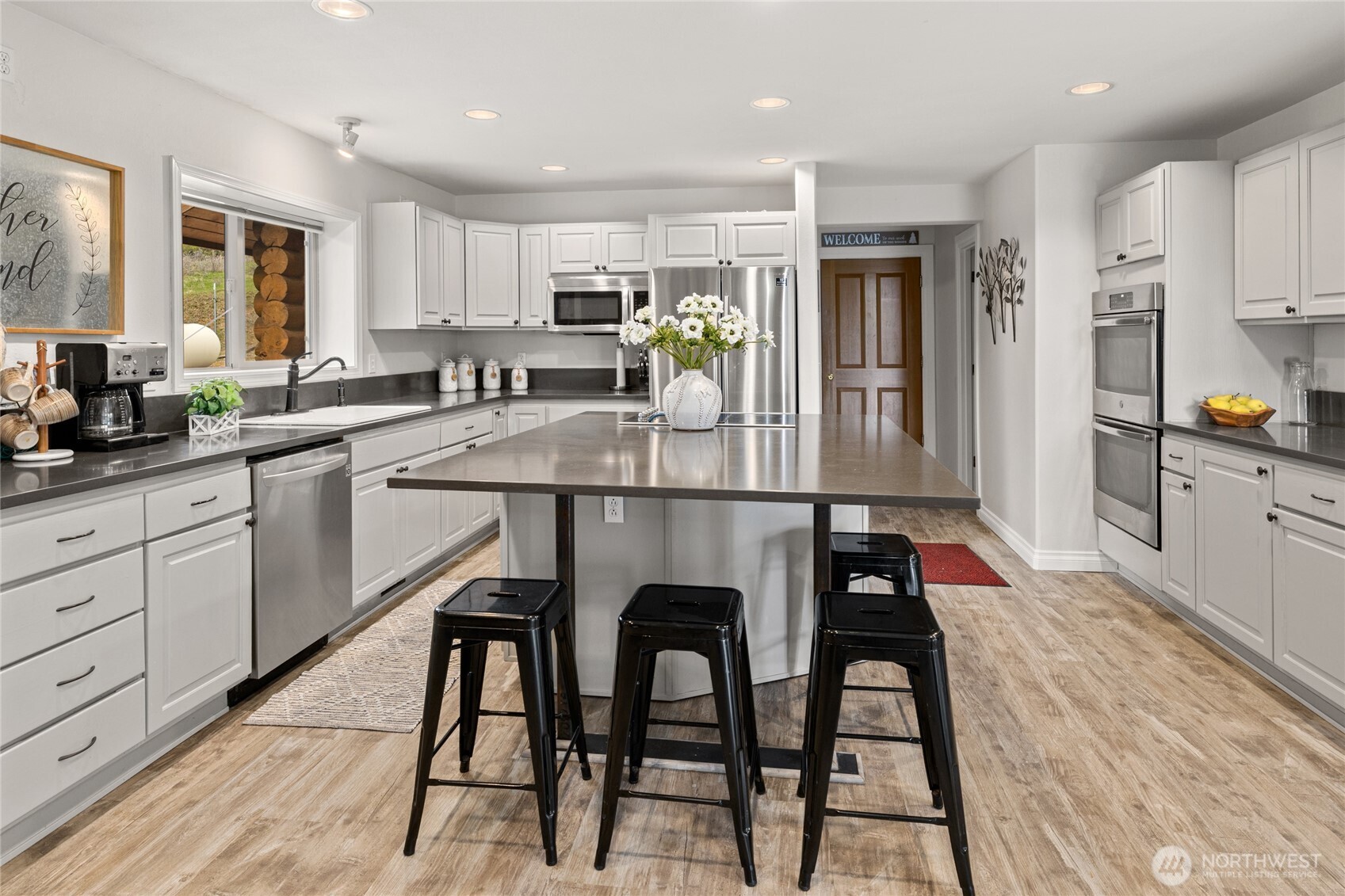 1161 White Road Cle Elum, WA 98922 - Photo 11 of 38 a kitchen with granite countertop white cabinets and stainless steel appliances