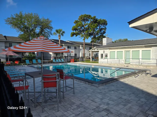 a view of a house with a yard porch and sitting area
