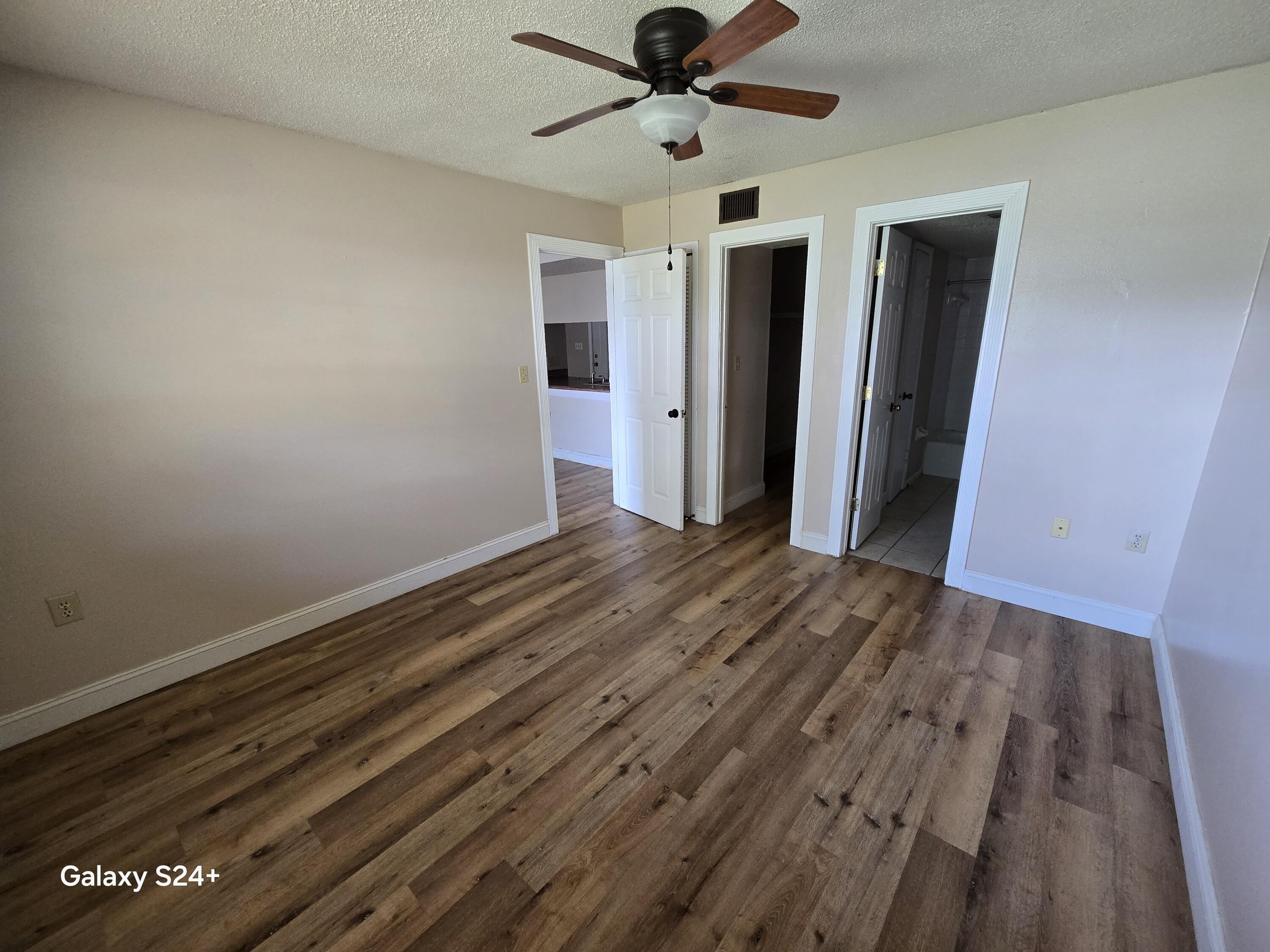 605 Colonial Drive, Unit 4 Fort Walton Beach, FL 32547 - Photo 3 of 13 a view of an empty room and wooden floor