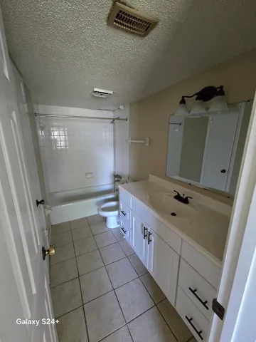 a bathroom with a double vanity sink and mirror