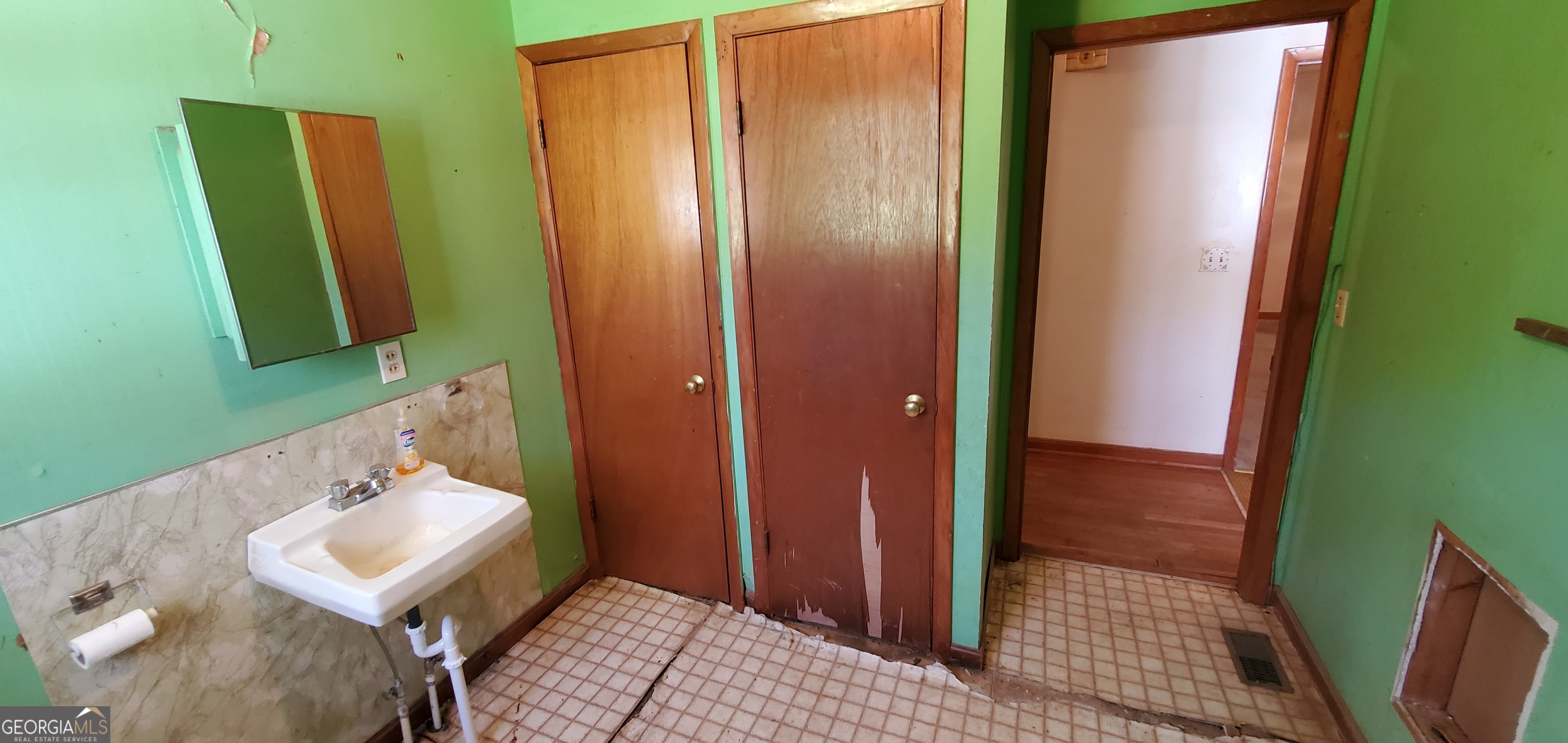 1061 Burger Road Watkinsville, GA 30677 - Photo 24 of 43 a bathroom with a sink a toilet and mirror