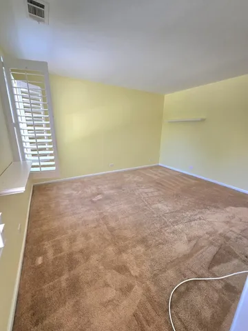 a view of a room with windows