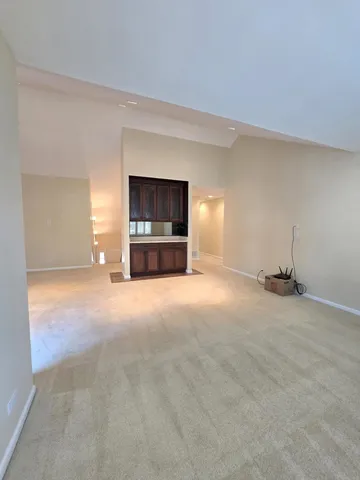 a view of empty room with a fireplace