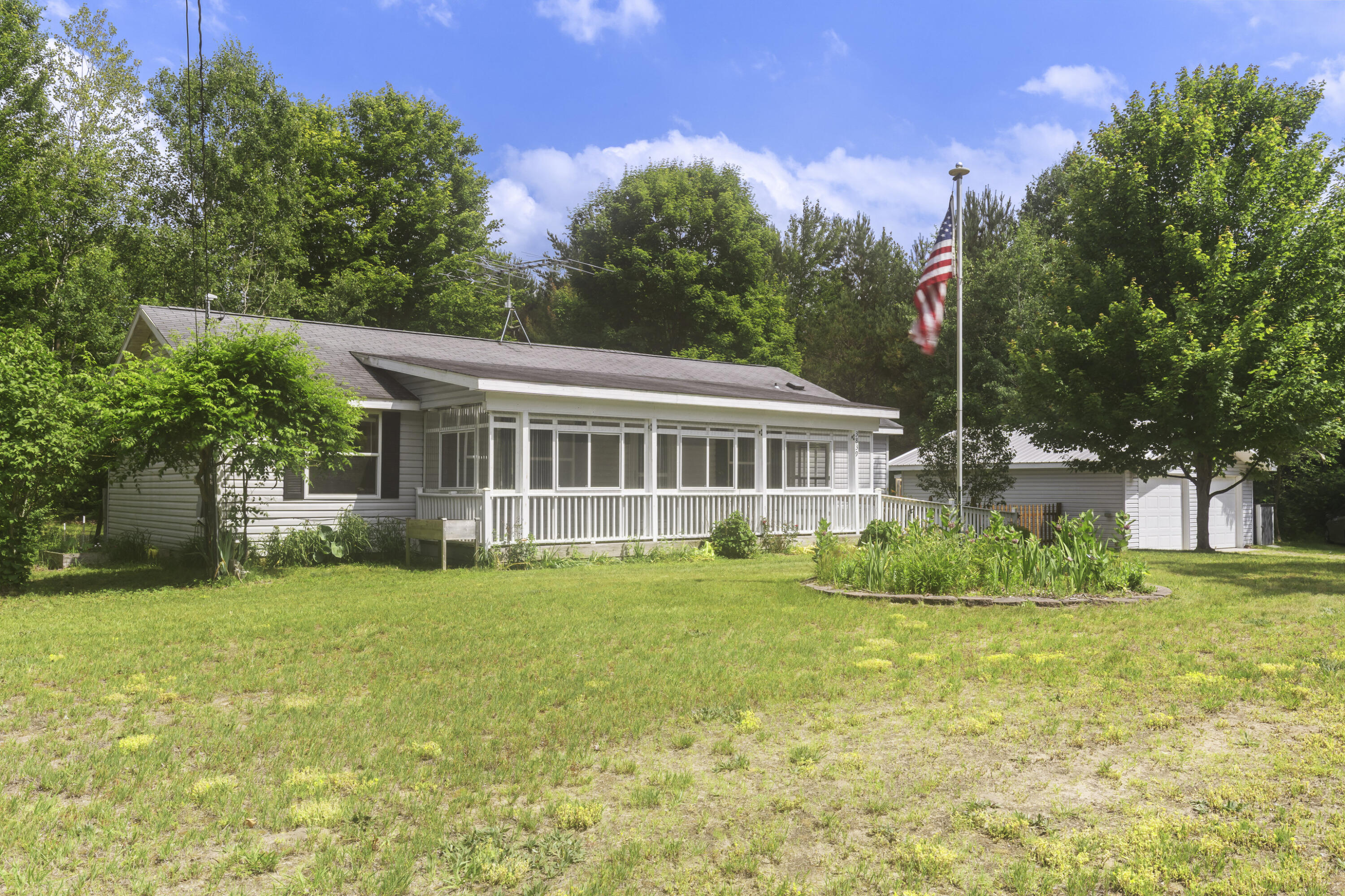 3839 Wallaker Road Benzonia, MI 49616 - Photo 1 of 37 0S5A1447