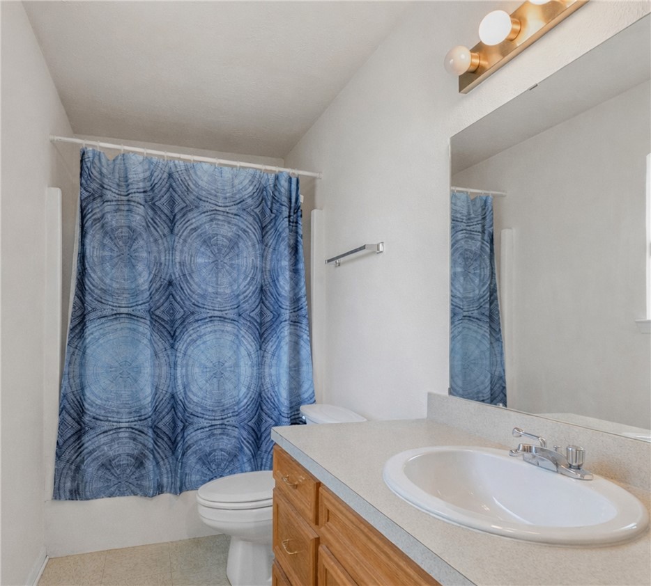 1003 West 17th Street Bryan, TX 77803 - Photo 6 of 6 Bathroom featuring vanity and toilet