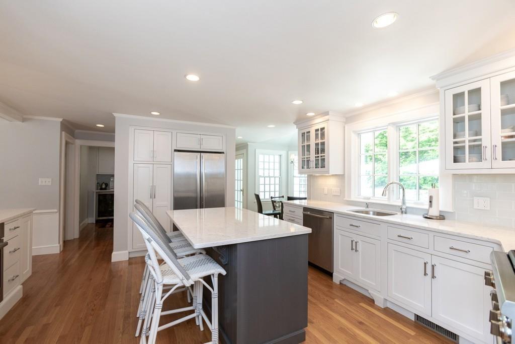 11 Arnold Road Wellesley, MA 02481 - Photo 12 of 33 a large kitchen with a table and chairs in it