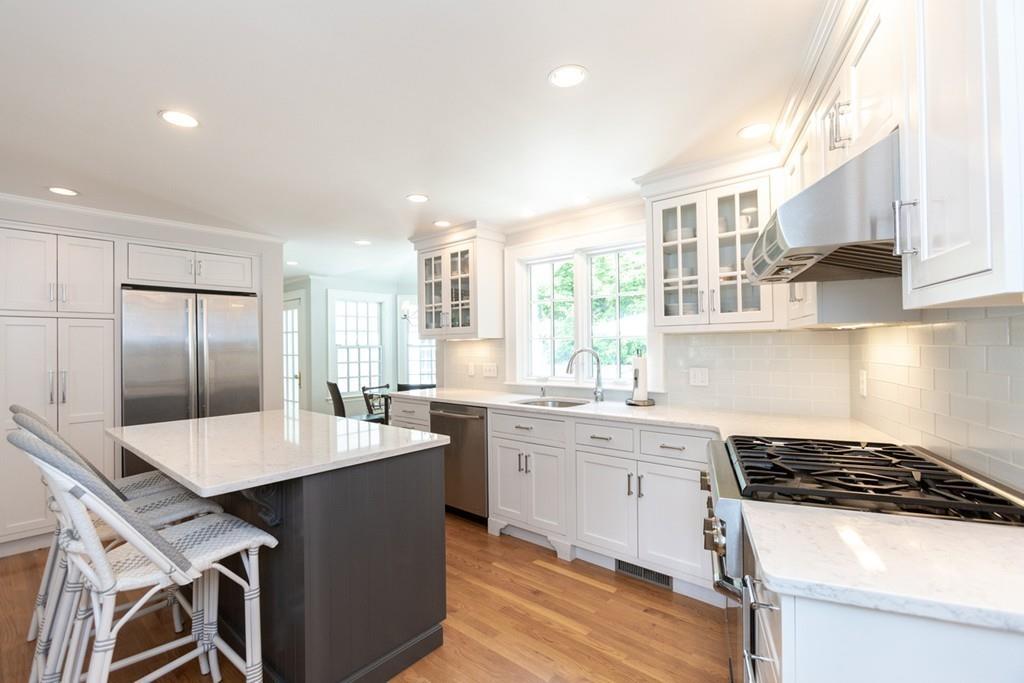 11 Arnold Road Wellesley, MA 02481 - Photo 13 of 33 a kitchen with granite countertop a sink stove and refrigerator