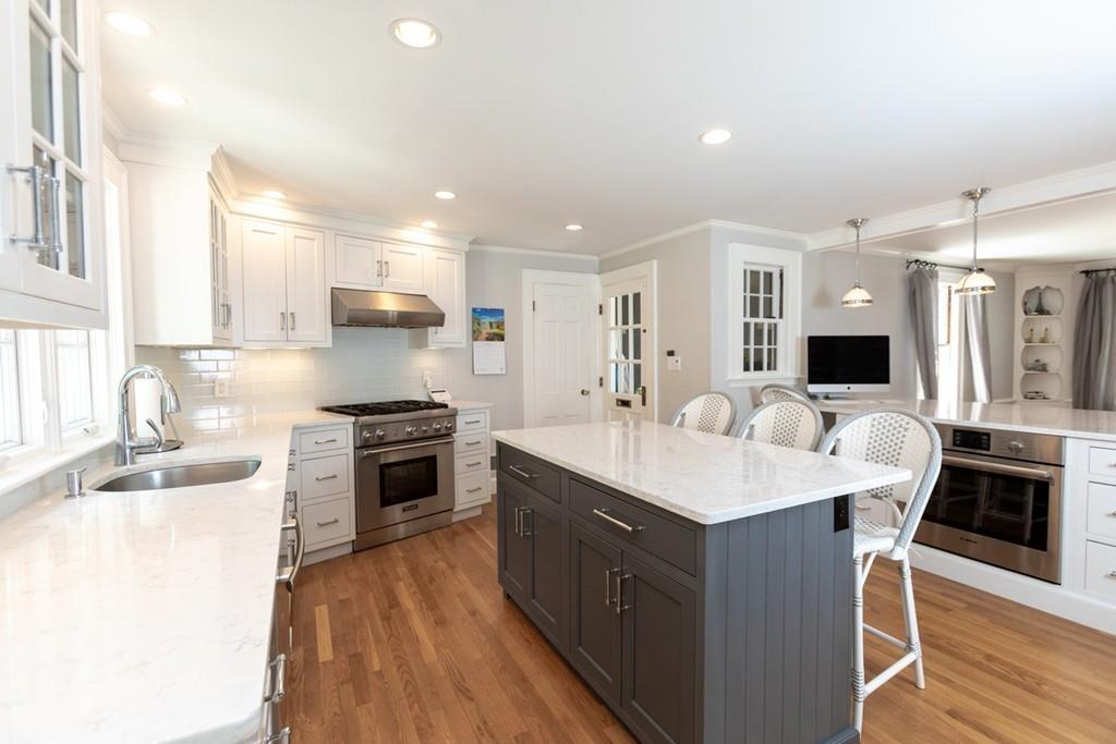 11 Arnold Road Wellesley, MA 02481 - Photo 14 of 33 a open kitchen with stainless steel appliances granite countertop a sink stove and refrigerator