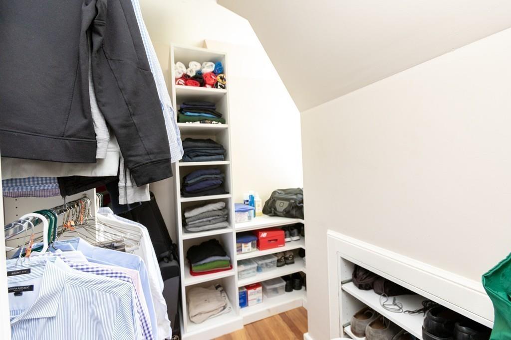 11 Arnold Road Wellesley, MA 02481 - Photo 23 of 33 a view of walk in closet with clothes and shoes
