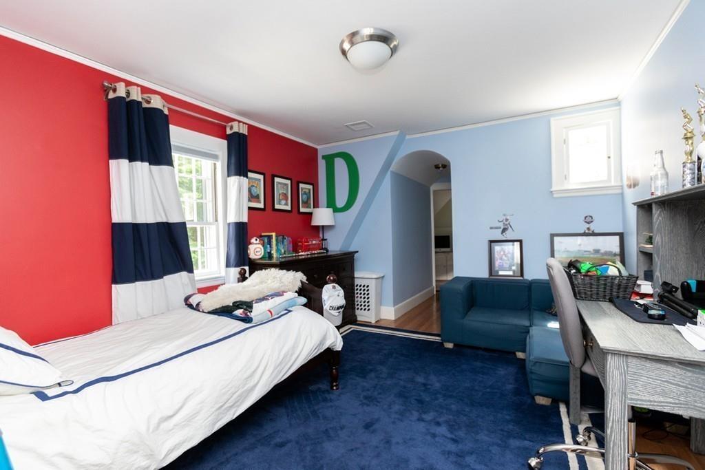 11 Arnold Road Wellesley, MA 02481 - Photo 24 of 33 a bedroom with a bed bookshelf and a window