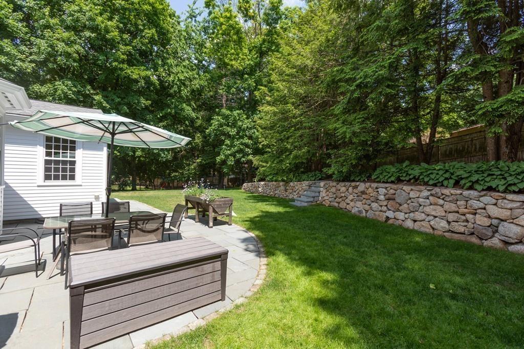 11 Arnold Road Wellesley, MA 02481 - Photo 29 of 33 a view of a patio with table and chairs potted plants and large tree