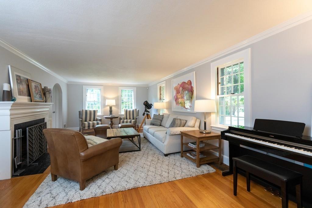 11 Arnold Road Wellesley, MA 02481 - Photo 6 of 33 a living room with fireplace furniture and a wooden floor