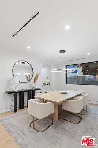 a stove top oven sitting inside of a kitchen