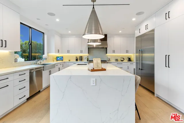 a living room with furniture large window and a flat screen tv