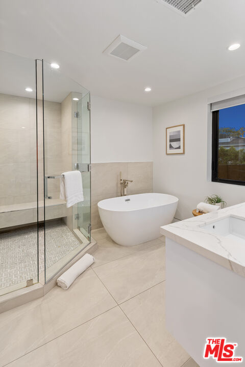 731 North Curson Avenue Los Angeles, CA 90046 - Photo 34 of 75 a spacious bathroom with a sink and a mirror