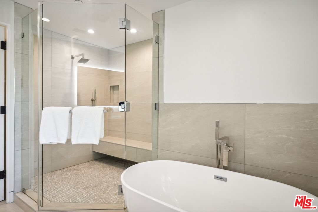 731 North Curson Avenue Los Angeles, CA 90046 - Photo 36 of 75 a bathroom with a bathtub and shower