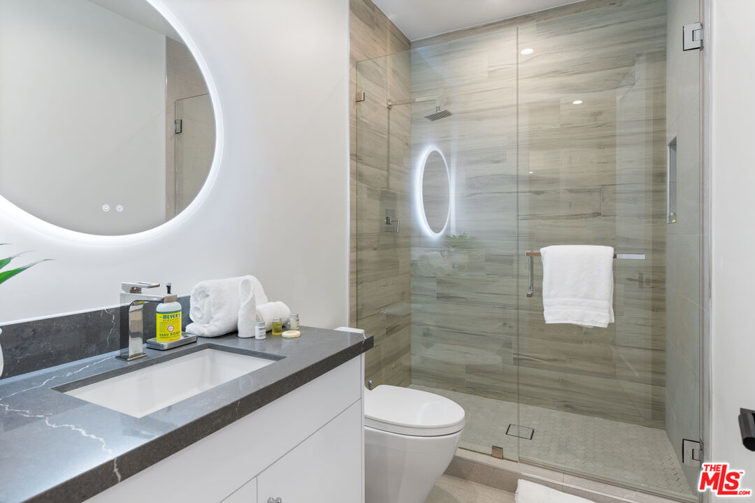 731 North Curson Avenue Los Angeles, CA 90046 - Photo 43 of 75 a bathroom with a sink a toilet and shower