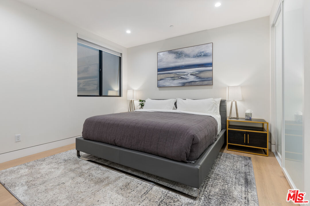 731 North Curson Avenue Los Angeles, CA 90046 - Photo 47 of 75 a bedroom with a bed and dresser