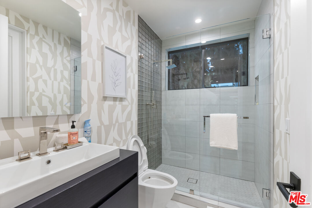 731 North Curson Avenue Los Angeles, CA 90046 - Photo 48 of 75 a bathroom with a sink a toilet and shower