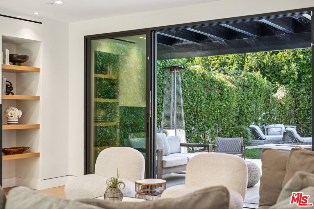 731 North Curson Avenue Los Angeles, CA 90046 - Photo 63 of 75 a living room with furniture and a window