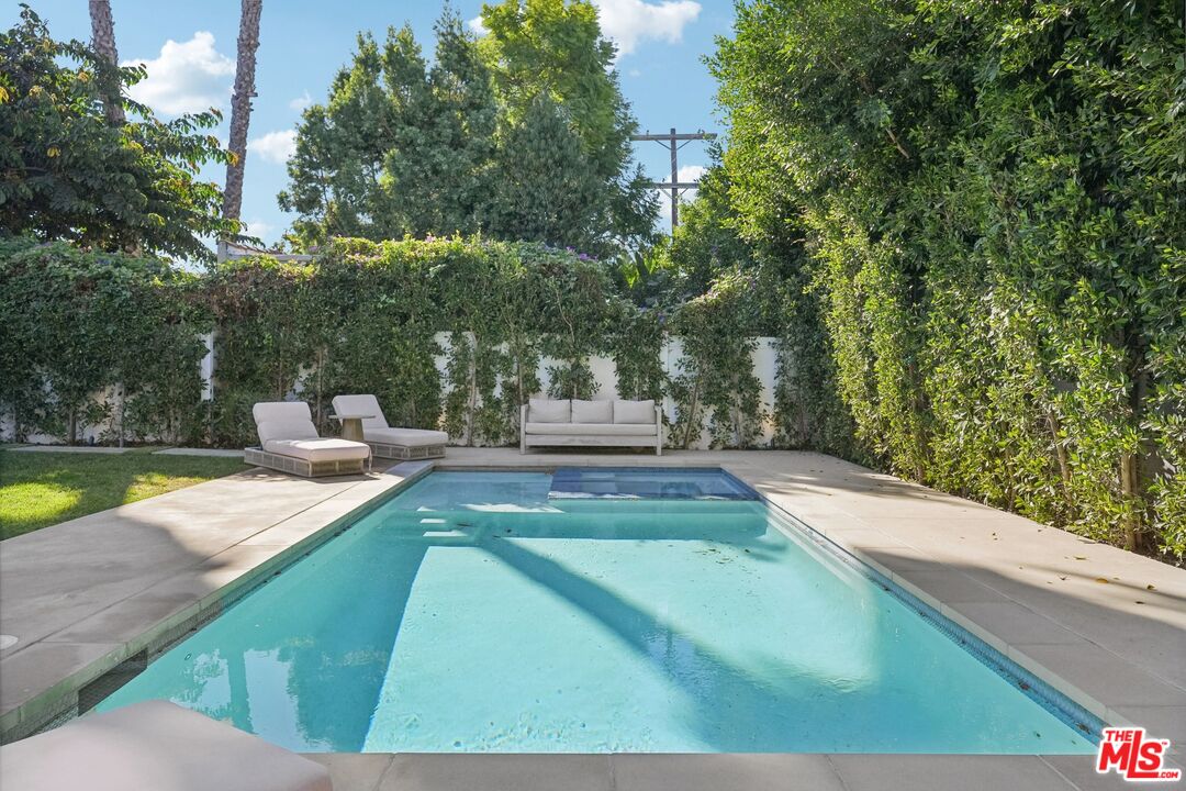 731 North Curson Avenue Los Angeles, CA 90046 - Photo 66 of 75 a view of a swimming pool with a patio