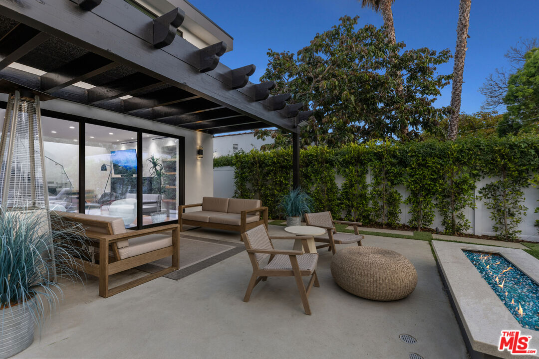 731 North Curson Avenue Los Angeles, CA 90046 - Photo 71 of 75 a living room with patio furniture and a potted plant
