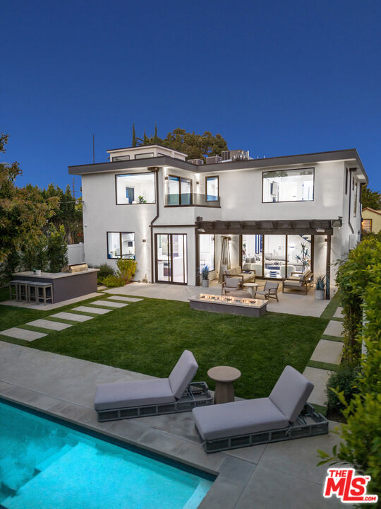 731 North Curson Avenue Los Angeles, CA 90046 - Photo 74 of 75 a view of a yard with furniture