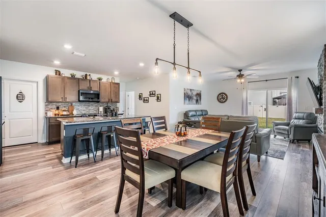 a kitchen with a table and chairs in it