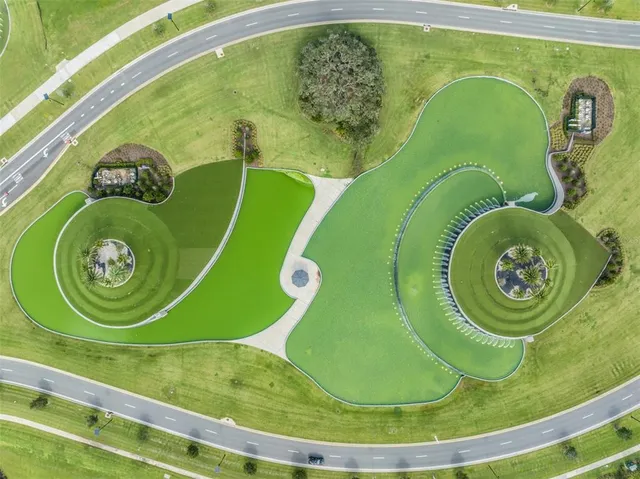 a view of a swimming pool and outdoor seating