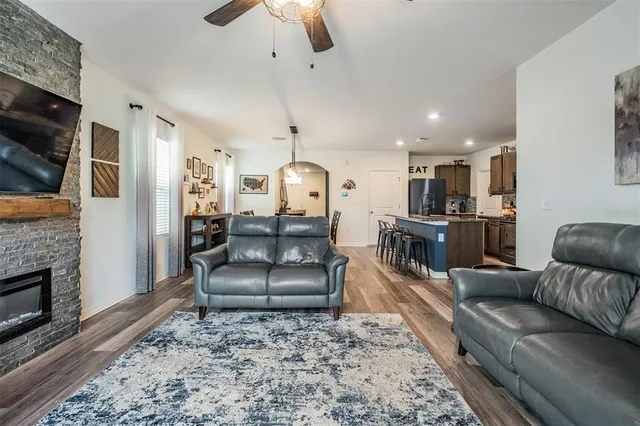 a living room with furniture and a fireplace
