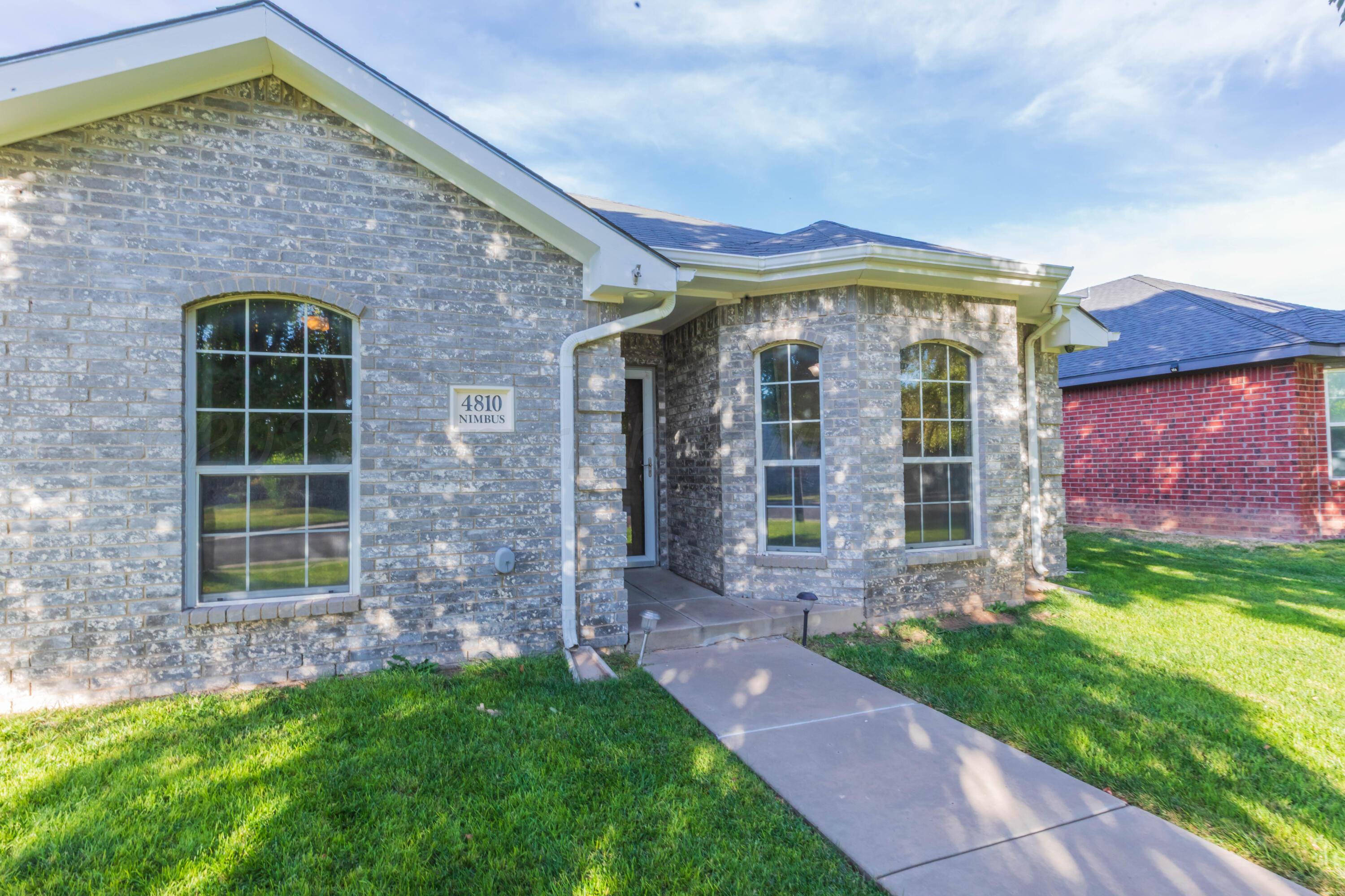 4810 Nimbus Lane Amarillo, TX 79110 - Photo 12 of 45 a front view of a house with garden