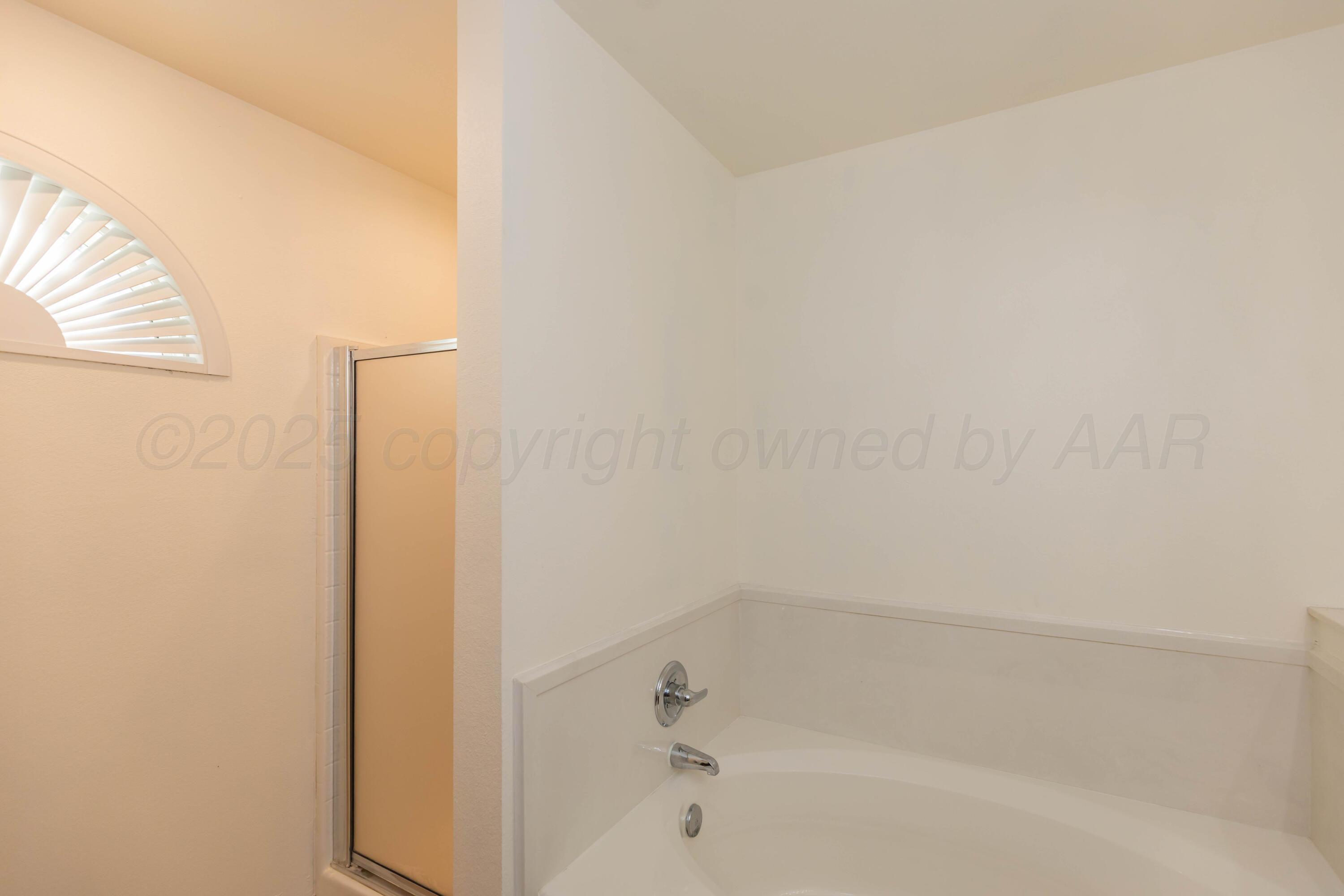 4810 Nimbus Lane Amarillo, TX 79110 - Photo 27 of 45 a bathroom with a bathtub