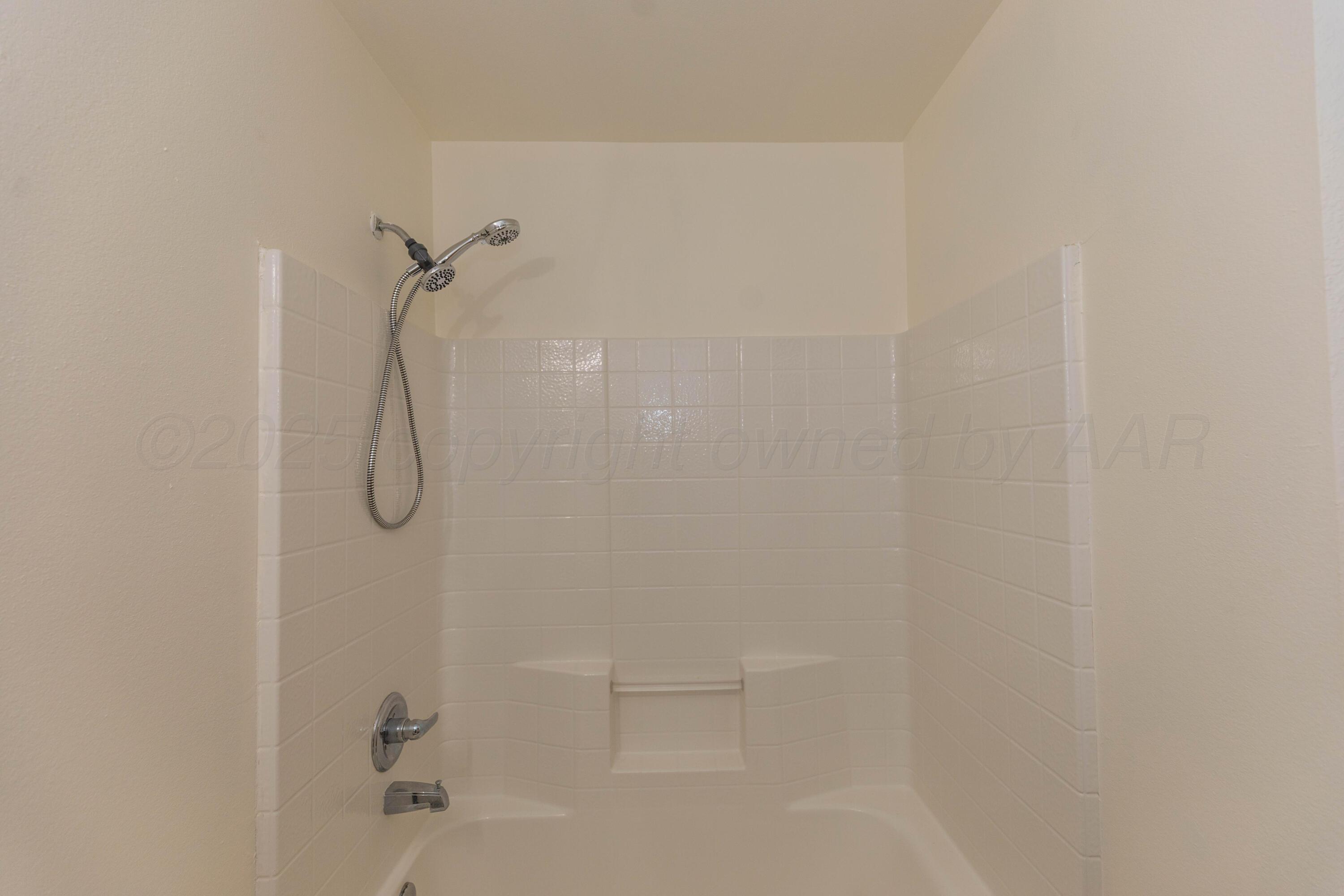 4810 Nimbus Lane Amarillo, TX 79110 - Photo 33 of 45 a bathroom with a shower