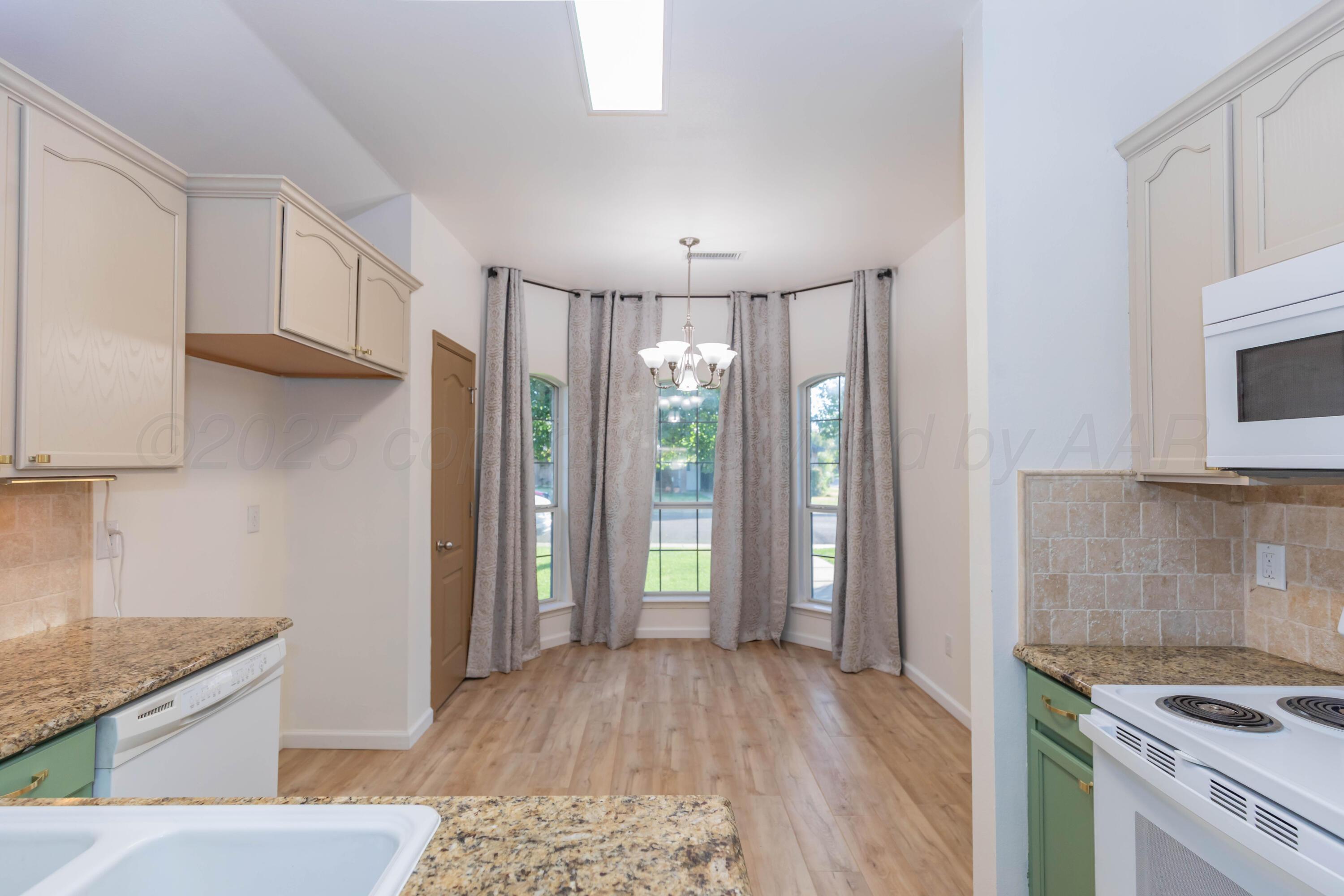 4810 Nimbus Lane Amarillo, TX 79110 - Photo 4 of 45 a view of kitchen with granite countertop cabinets appliances and a counter space