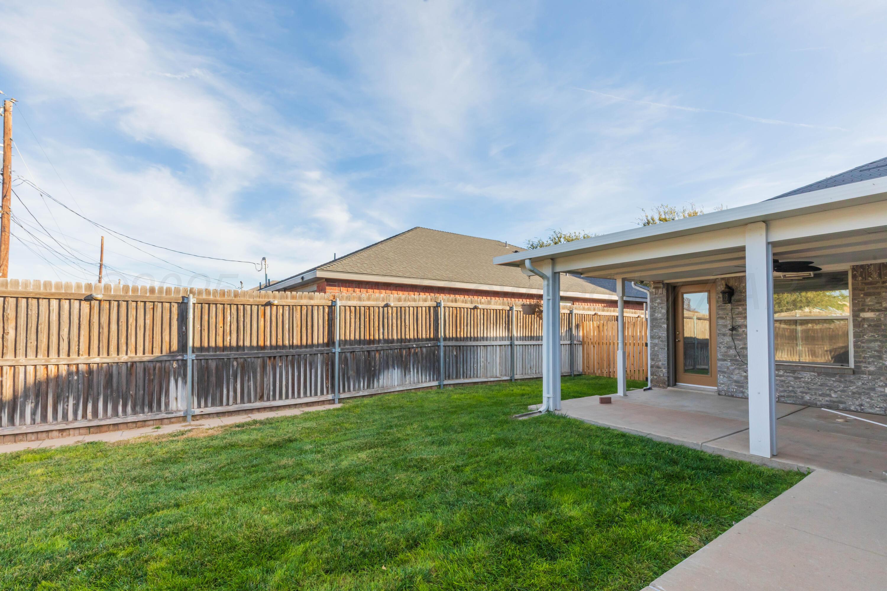 4810 Nimbus Lane Amarillo, TX 79110 - Photo 41 of 45 a view of a house with a yard and porch