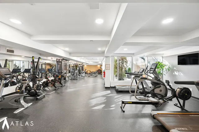 a bathroom with a sink mirror and a shower