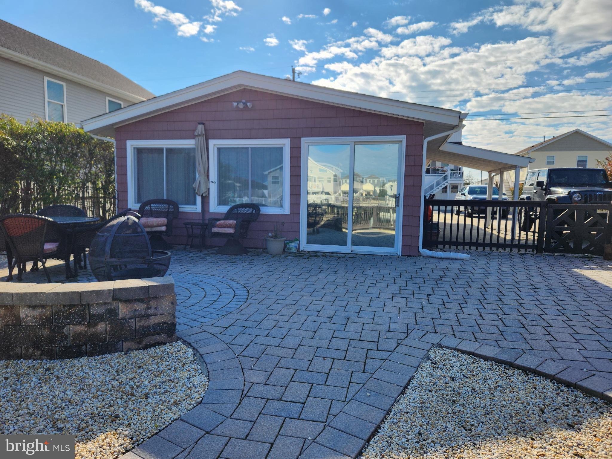 14 West Thames Road Little Egg Harbor, NJ 08087 - Photo 2 of 13 a view of a house with backyard porch and sitting area