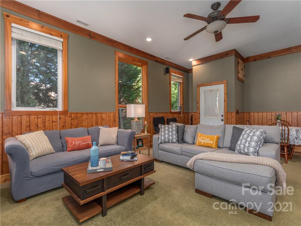 456 Walker Road Waynesville, NC 28786 - Photo 11 of 24 a living room with furniture and a large window
