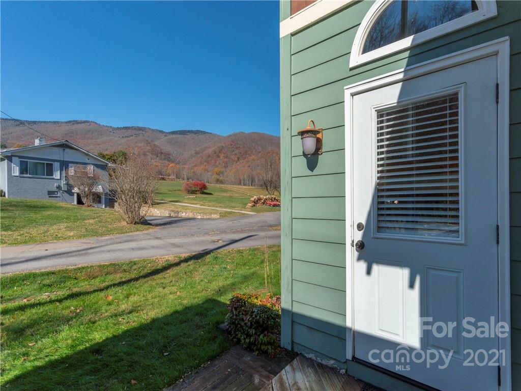 456 Walker Road Waynesville, NC 28786 - Photo 21 of 24 a view of a house with a yard