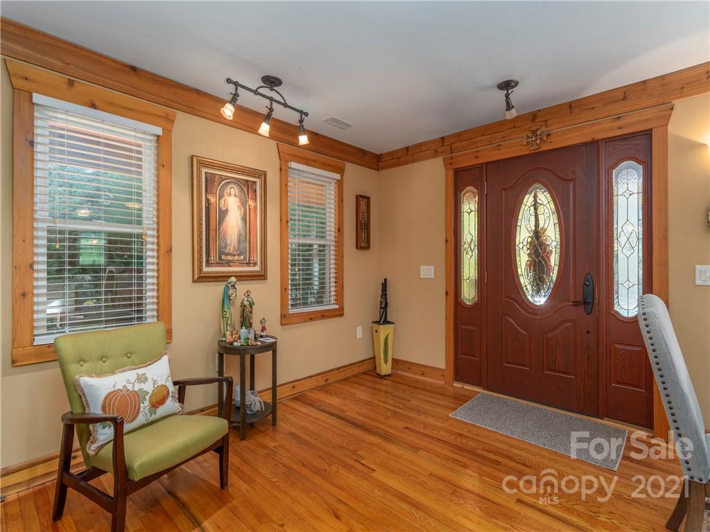 456 Walker Road Waynesville, NC 28786 - Photo 4 of 24 a spacious bedroom with a bed and a window