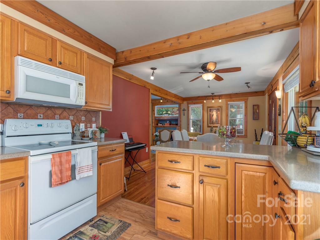 456 Walker Road Waynesville, NC 28786 - Photo 8 of 24 a kitchen with stainless steel appliances granite countertop a sink and cabinets