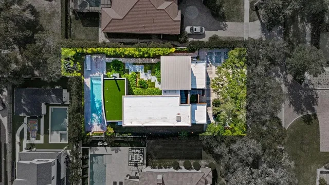 an aerial view of house with a yard