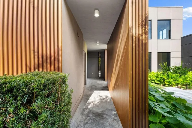 a large kitchen with a table and chairs