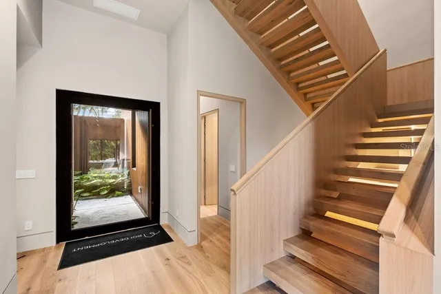 a bathroom with a toilet a sink and shower