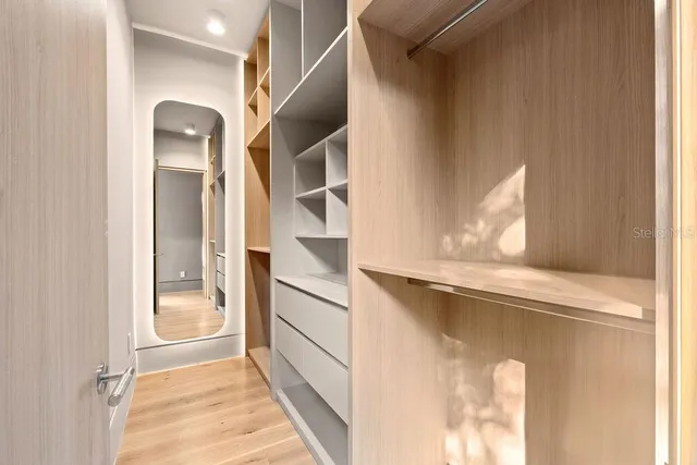 a view of an empty walk in closet