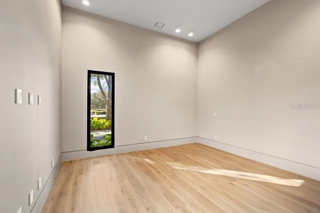 a bathroom with double vanity sinks and a mirror
