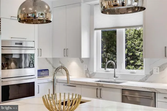 a view of a hallway with wooden floor and entryway