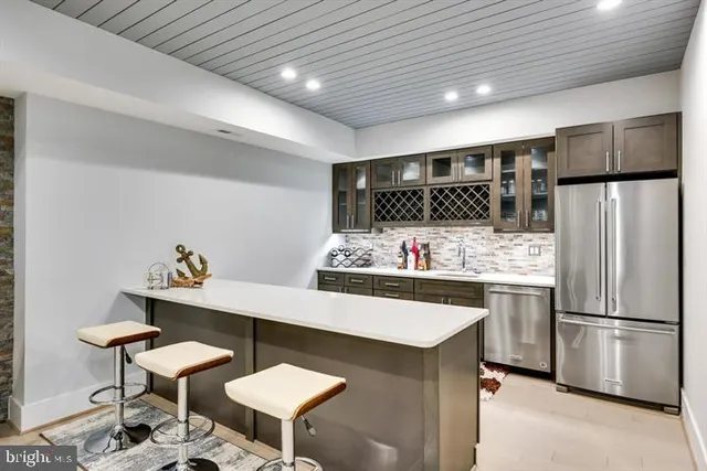 a swimming pool with trees in the background